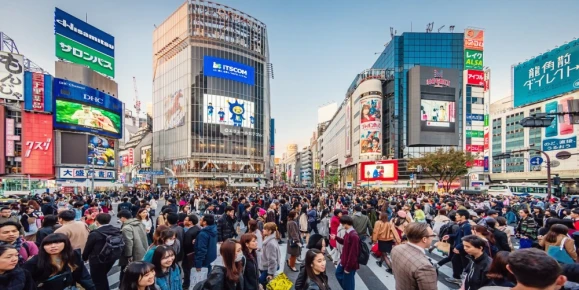 People crossing the crowded famous Shibuya Crossing in Downtown Tokyo