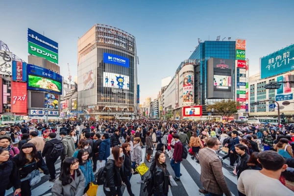 People crossing the crowded famous Shibuya Crossing in Downtown Tokyo