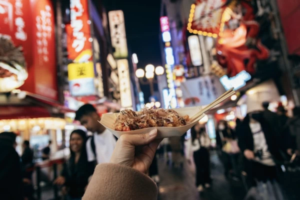 Japanese traditional street food called Takoyaki (octopus balls)