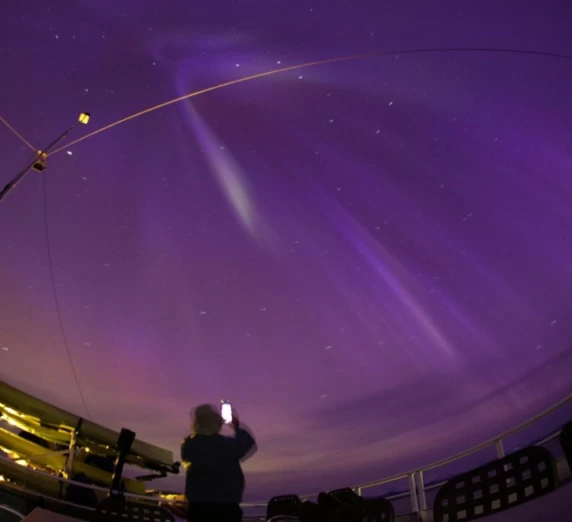 Catching the Northern Lights from the deck of the Wilderness Discoverer