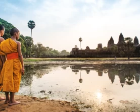 Young Buddhist monks in saffron robes at Angkor Wat