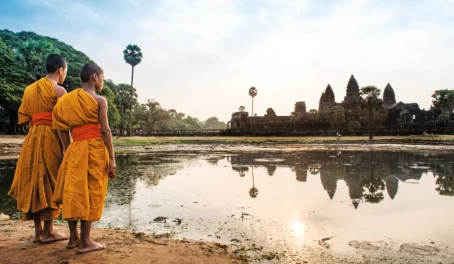 Young Buddhist monks in saffron robes at Angkor Wat