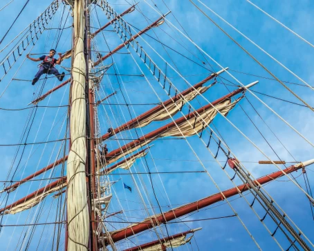 Sailor in the rigging on the ship Sea Cloud, Mediterranean, Greece