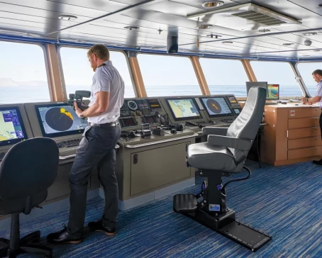 Captain Cook on the bridge of the ship National Geographic Quest/Venture