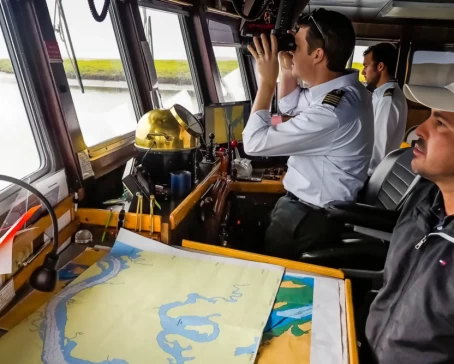 Lindblad Crew on the ships bridge navigating Hull Canal, National Geographic Sea Lion, Magdalena Bay