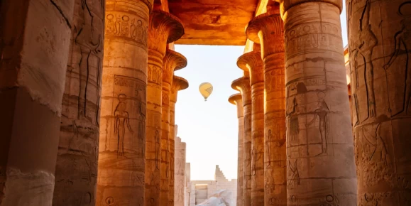 Balloons take to the sky at dawn above Pharaoh Ramesses II memorial temple in Theban Necropolis, Upper Egypt