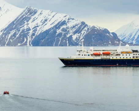Guests returning back to the ship National Geographic Explorer by zodiac, Spitsbergen, Arctic Ocean