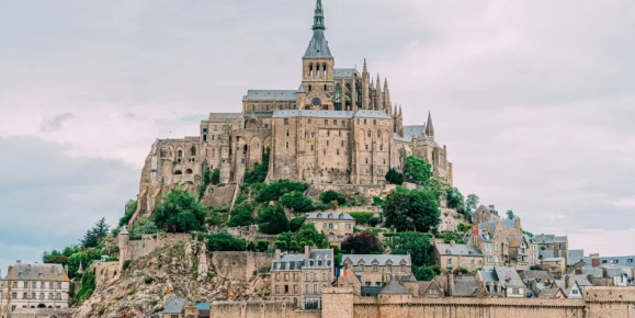 Mont Saint-Michel is a picturesque island commune in Normandy, France, renowned for its stunning medieval abbey perched atop a rocky hill