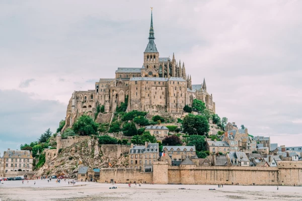 Mont Saint-Michel is a picturesque island commune in Normandy, France, renowned for its stunning medieval abbey perched atop a rocky hill