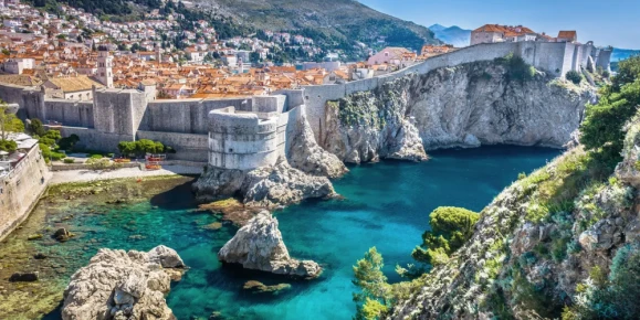A stunning fortified old town with massive stone walls overlooking the Adriatic Sea