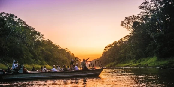 Guests explore the Amazon Dorado River at night by Skiff, Argentina