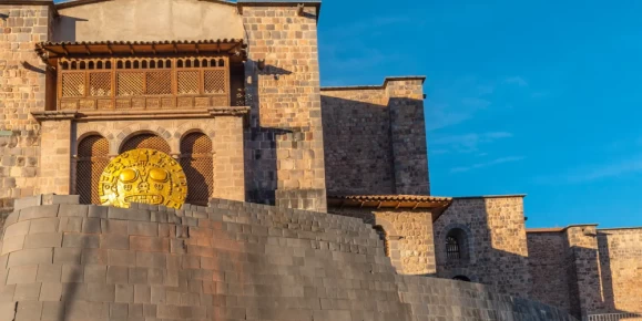 Panoramic view of Qorikancha during Inti Raymi, showcasing Inca stonework and the Santo Domingo convent in Cusco