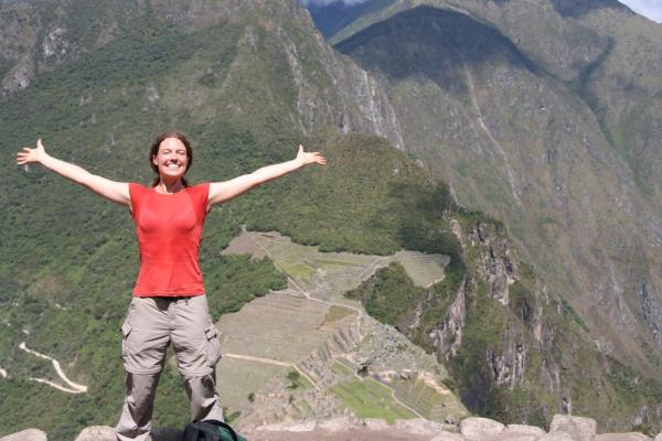 Happy trekker at the top of Huayna Picchu Peak