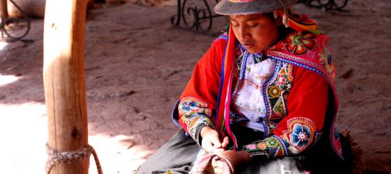 A local woman weaves in the market