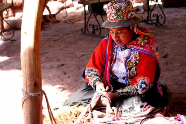 A local woman weaves in the market