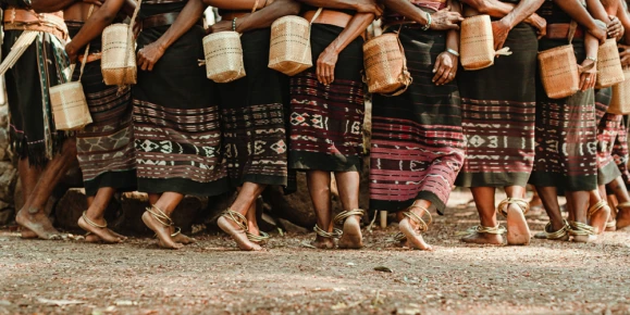 Forgotten Islands villagers performing a traditional dance in cultural attire.