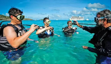 Travelers learning how to scuba dive.