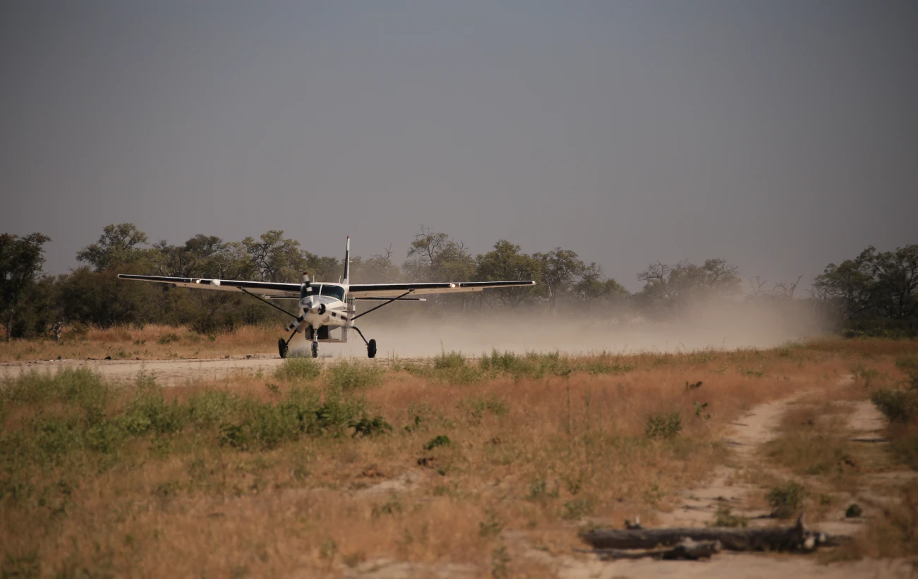 A bush plane taking off on airstrip
