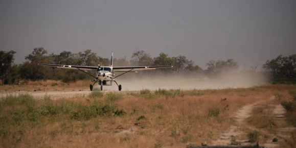 A bush plane taking off on airstrip