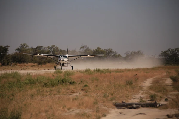 A bush plane taking off on airstrip