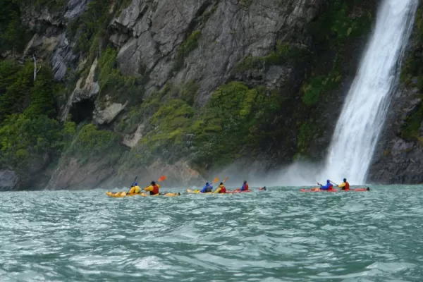 Kayaking under a waterfall in Patagonia