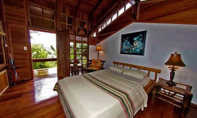 Rooms are nestled in the hillside with spectacular views of the tropical setting