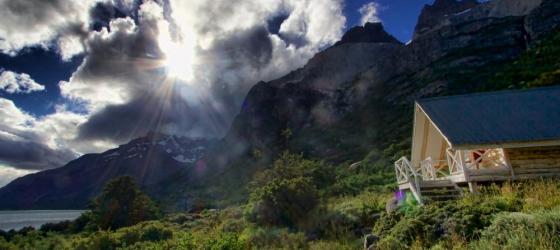The sun breaks through the clouds over the lodge