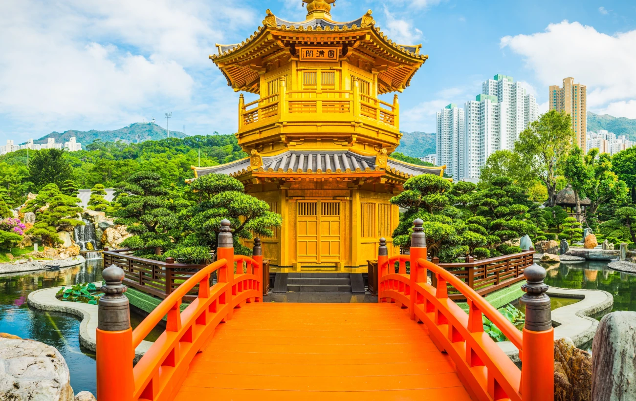 Hong Kong golden pagoda Nan Lian gardens beneath skyscrapers