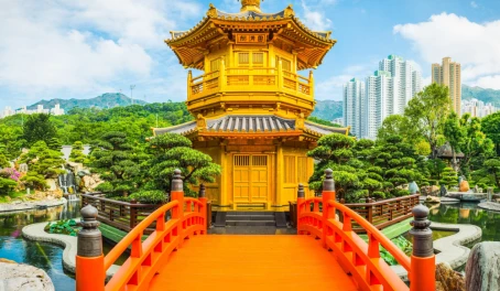Hong Kong golden pagoda Nan Lian gardens beneath skyscrapers