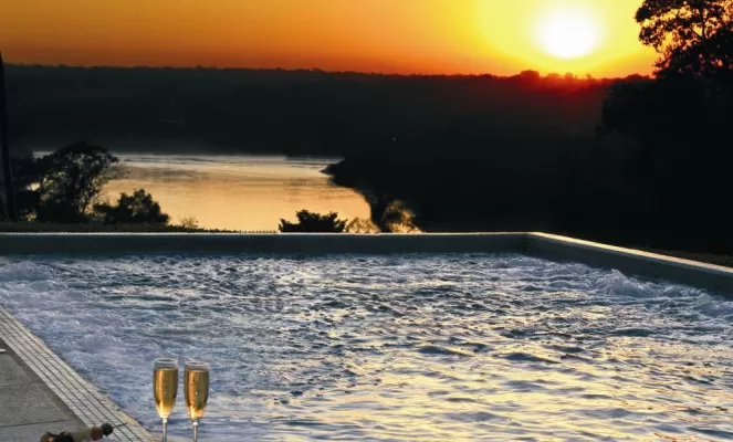 Enjoy spectacular sunsets over the confluence of the Iguazu and Parana rivers
