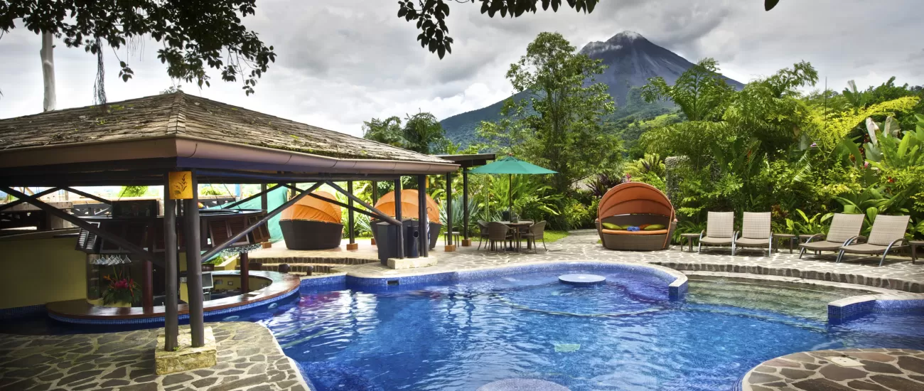 The pool features a volcano view