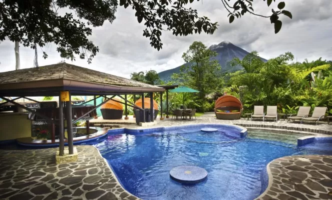 The pool features a volcano view