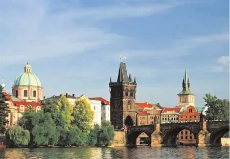 Walk the riverfront of Prague, one of the most beautiful of European cities