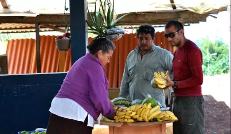 Buying some bananas from a roadside stand on San Cristobal