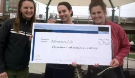 Lynessa Erin and Haley receive check for award