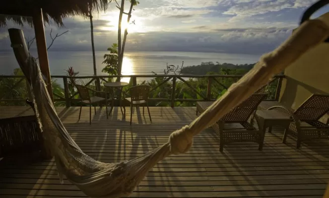 Bid the sun goodnight from your hammock at Lapa Rios Ecolodge