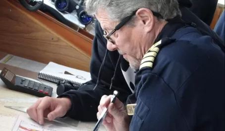 Captain examining ice charts