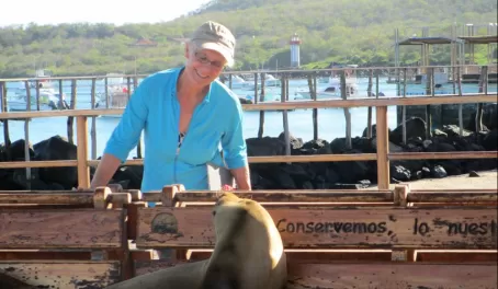 Theresa making friends with a San Cristobal Sea Lion