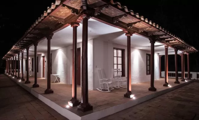 Elegant columns light the way to your room at Hacienda Piman