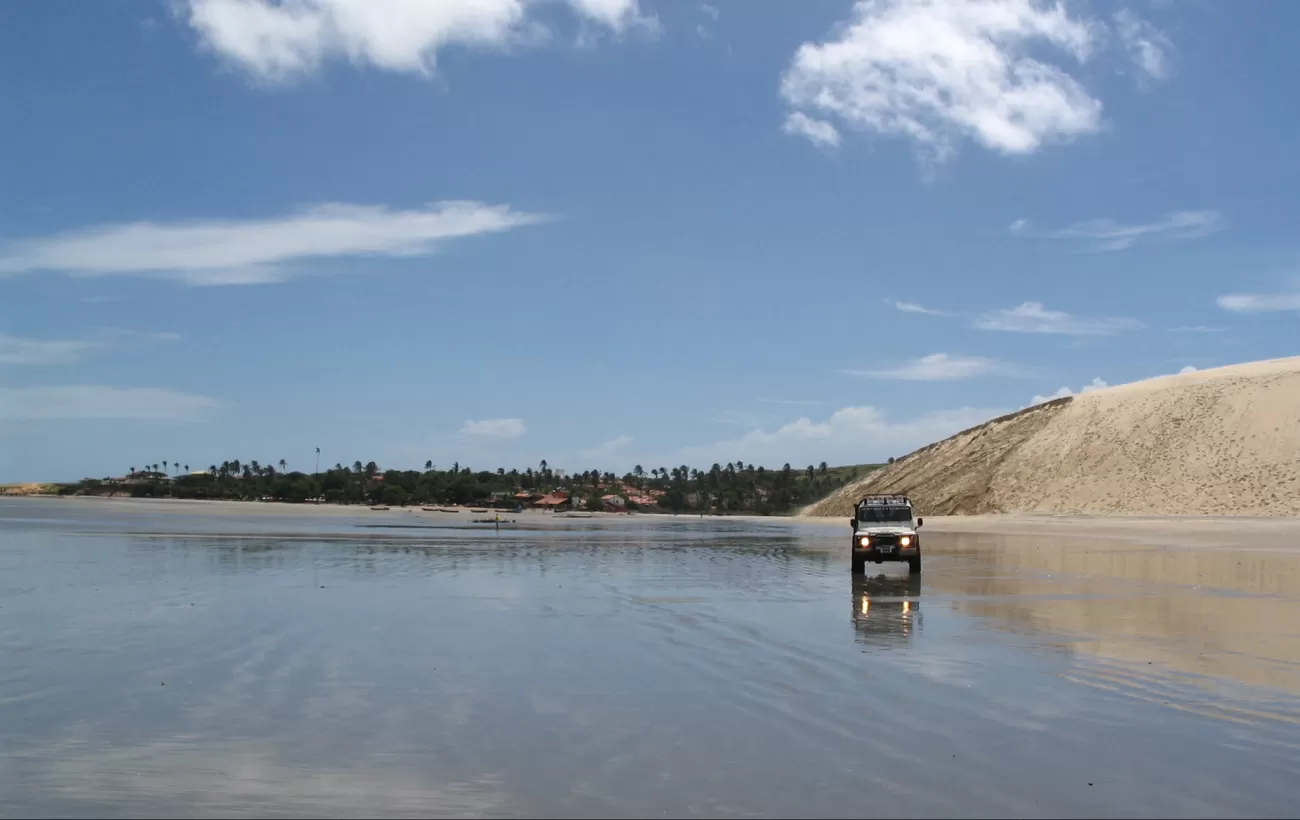 A truck drives the dunes of Jericoacoara, Brazil