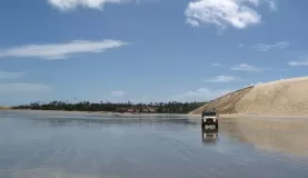 A truck drives the dunes of Jericoacoara, Brazil