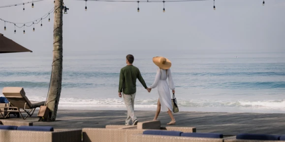 Walking along a beach in The Samaya Seminyak
