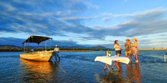 Travelers enjoying the amenities of Royal Zambezi Lodge in Lower Zambezi National Park