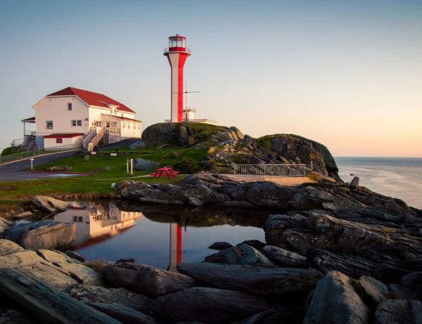 The iconic Cape Forchu Lighthouse, a popular tourist destination located in Yarmouth, Nova Scotia, Canada.