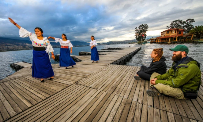 A cultural performance taking place on a dock in the Imbabura province of Ecuador
