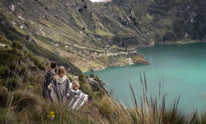 The breathtaking Quilotoa Lagoon in Ecuador, a stunning volcanic crater lake filled with emerald-green water.
