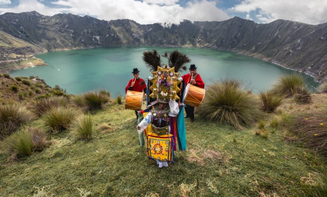 A traditional musical performance at the Quilotoa Lagoon in Ecuador, a volcanic crater lake known for its turquoise water