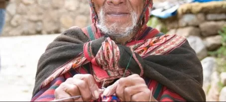 A local man knits in the market