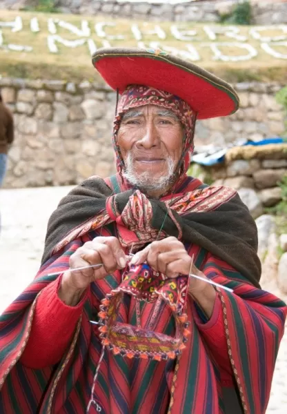 A local man knits in the market
