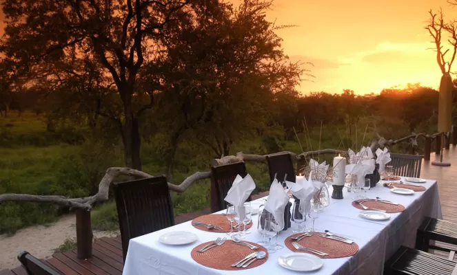 Simbambili Lodge's outdoor dining area is beautiful at sunset